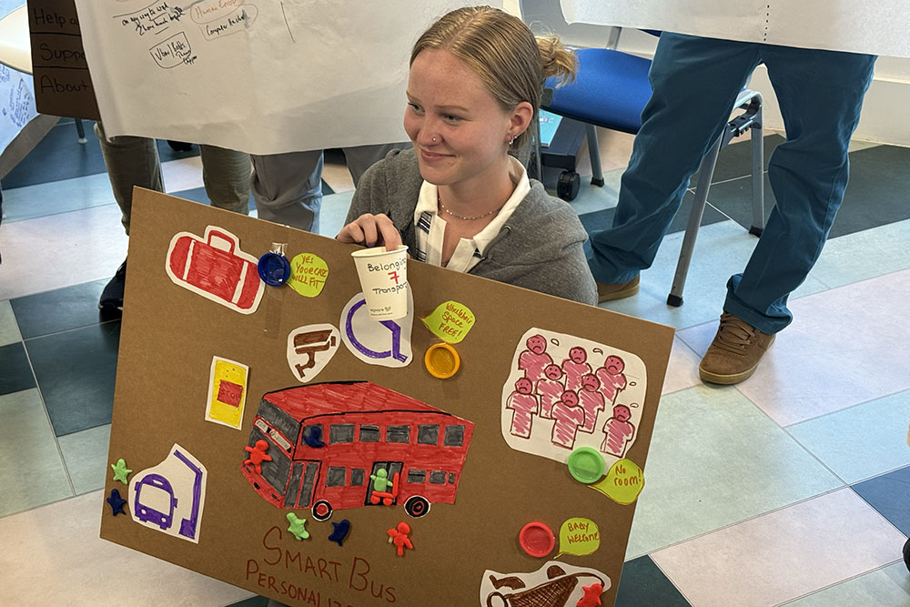 woman holding display board