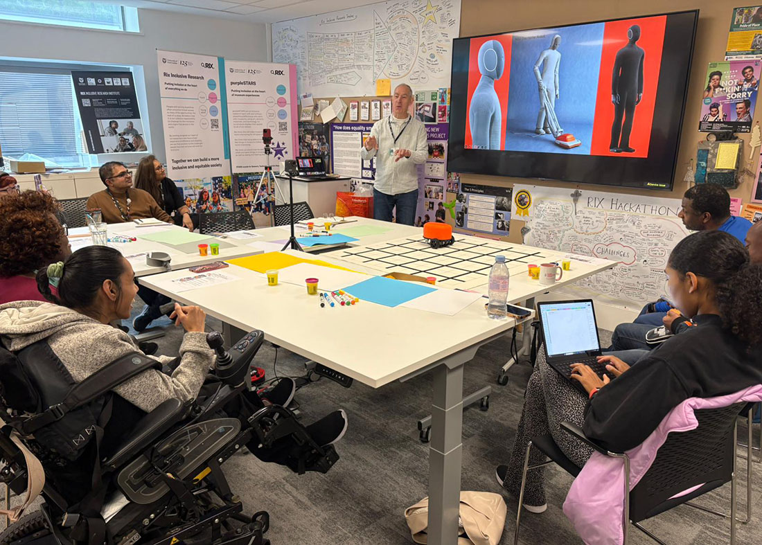 man presenting to mixed group