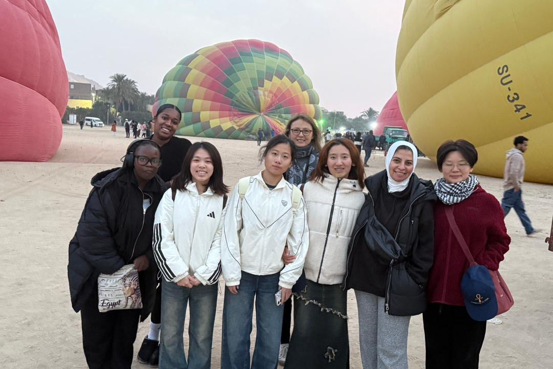 group of people with hot air balloons