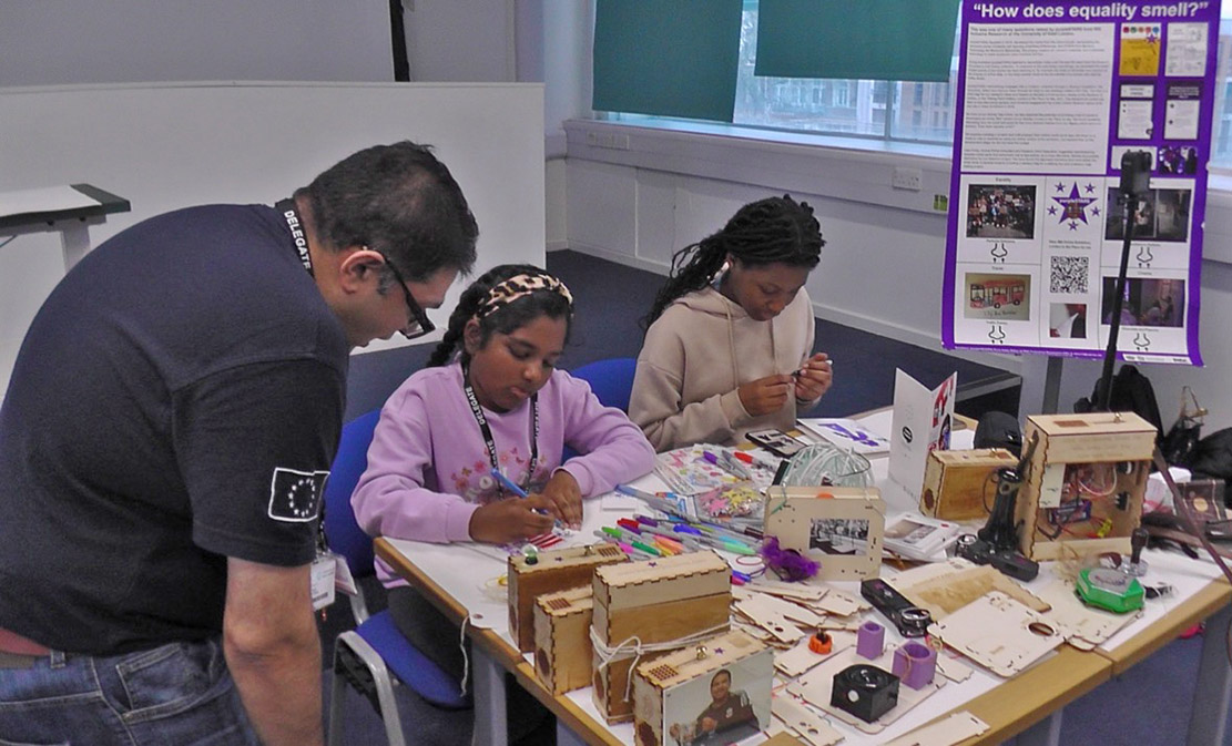 museum visitors making labels