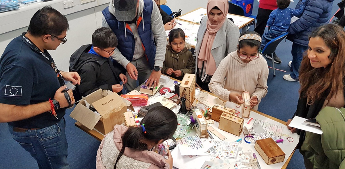museum visitors exploring sensory objects