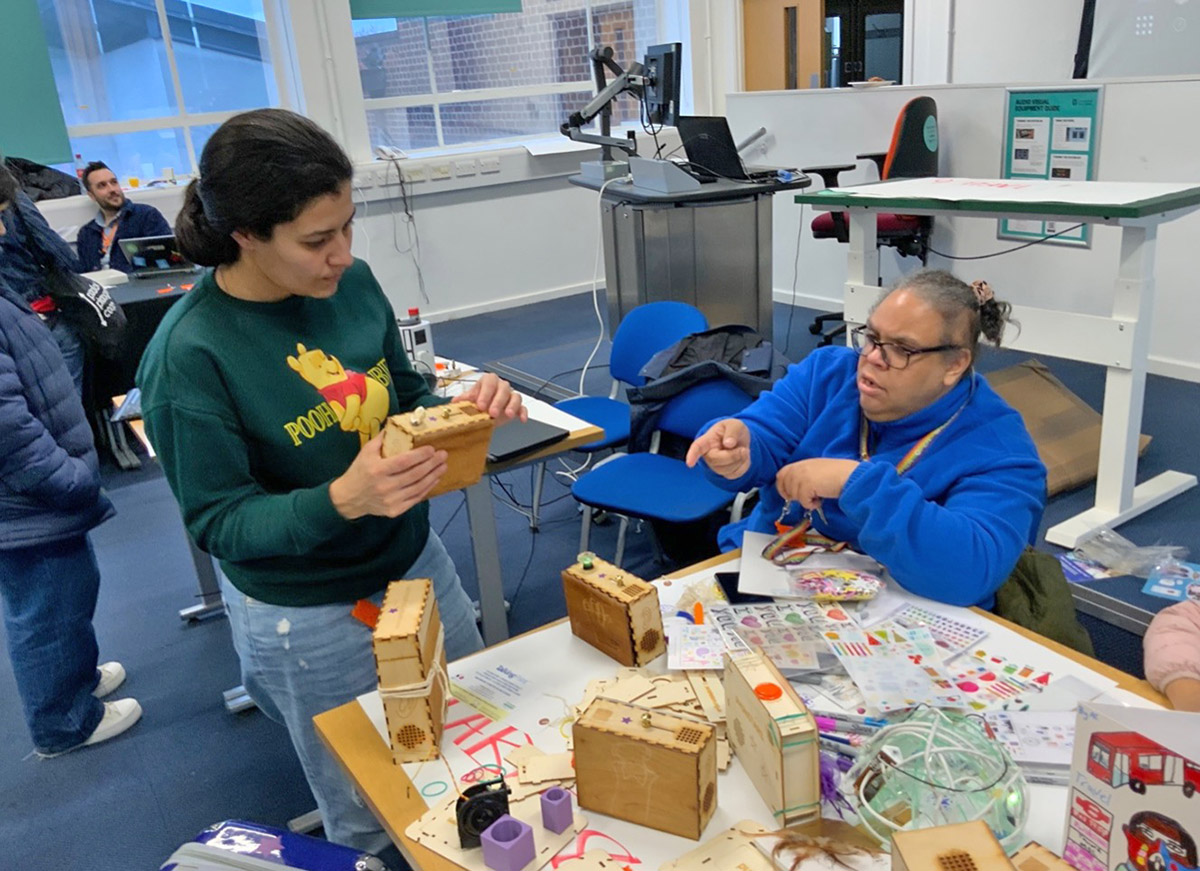 two women looking at sensory objects
