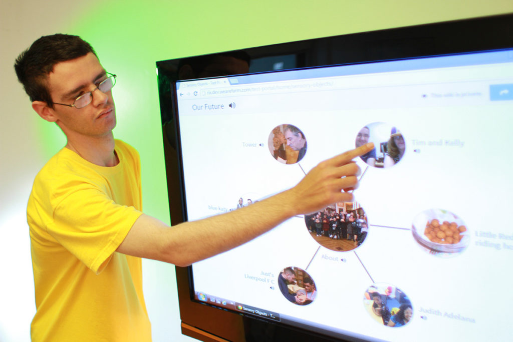 Young person showing Wiki on touchscreen