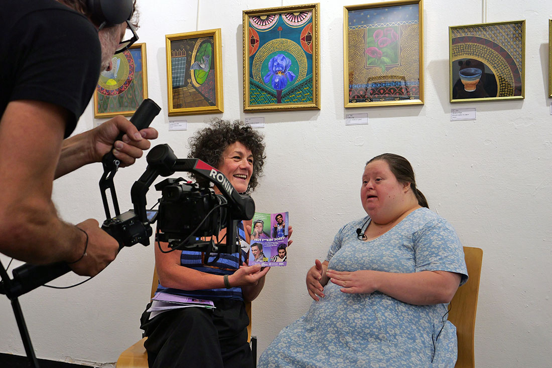 two women talking whilst being filmed
