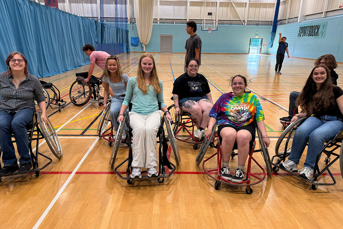 young people in basketball wheelchairs